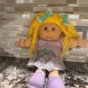 Charming Doll with Yellow Hair and Purple Outfit